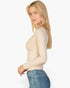 Beach Rose Co. beige ribbed long-sleeve crew-neck top worn by a blonde model with blue jeans