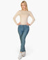 Beach Rose Co. beige ribbed long-sleeve crew-neck top worn by a blonde model with blue jeans and white sneakers