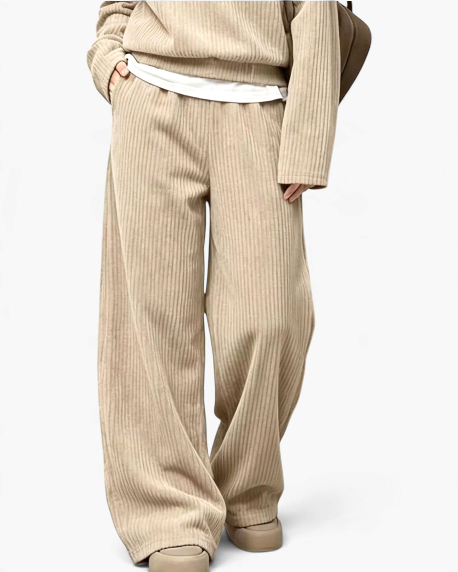 Beach Rose Co. beige ribbed two-piece set featuring wide leg pants and a relaxed long-sleeve top with side pockets.