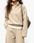 Beach Rose Co. beige ribbed two-piece set with collared button-placket top and wide leg pants on a model.
