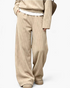 Beach Rose Co. beige ribbed two-piece set featuring wide leg pants and a relaxed long-sleeve top with side pockets.