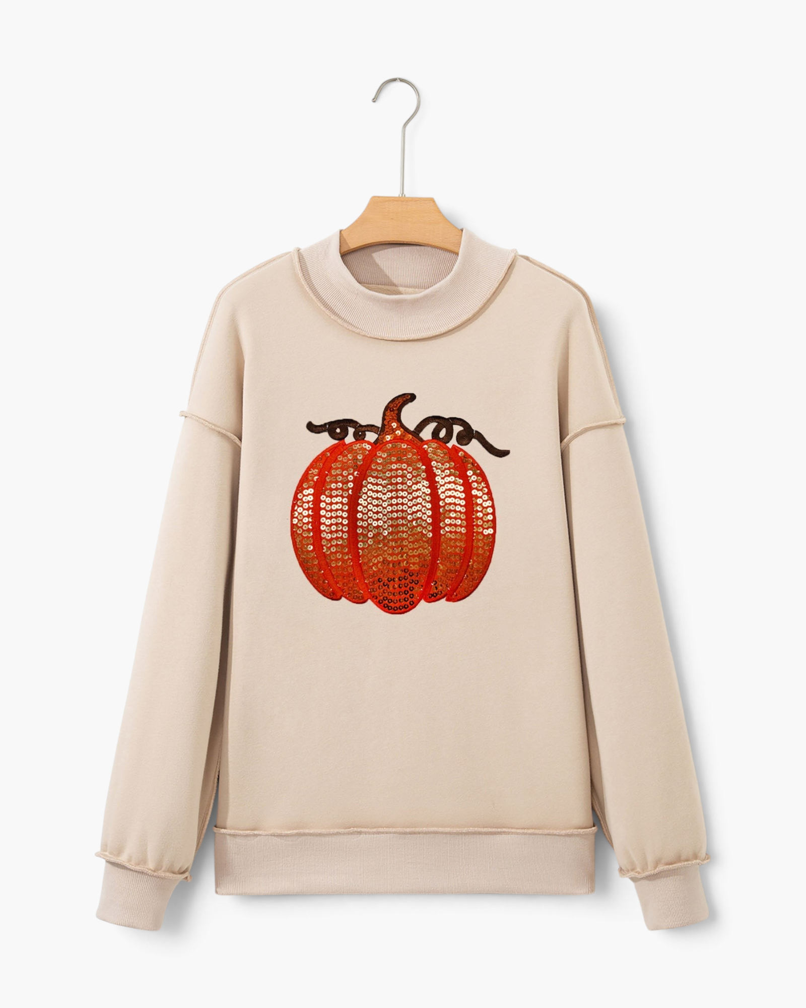 Beach Rose Co. beige sweatshirt featuring an orange and brown sequin pumpkin motif with long sleeves and ribbed trim.