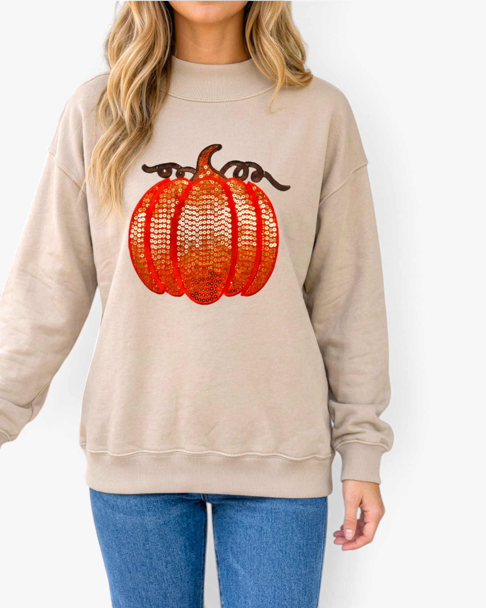 Beach Rose Co. beige relaxed fit sweatshirt featuring an orange and brown sequin pumpkin design with ribbed trim.