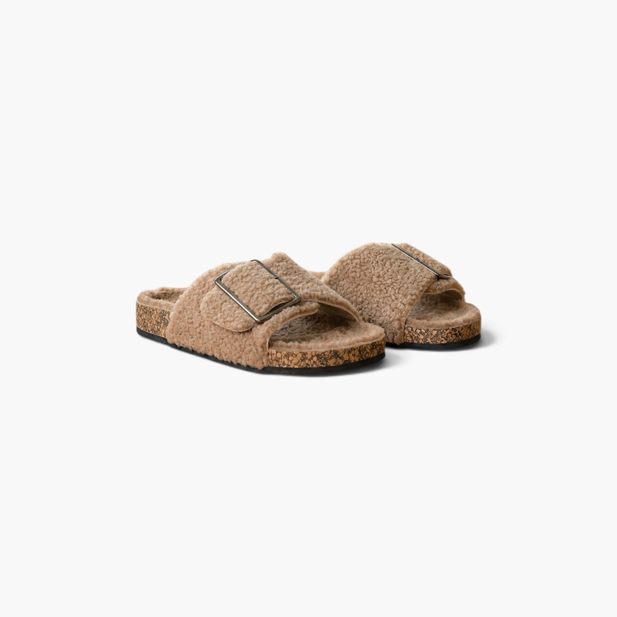 Beach Rose Co. Rochelle beige vegan suede sherpa slippers with crossed bands and a metal buckle detail.