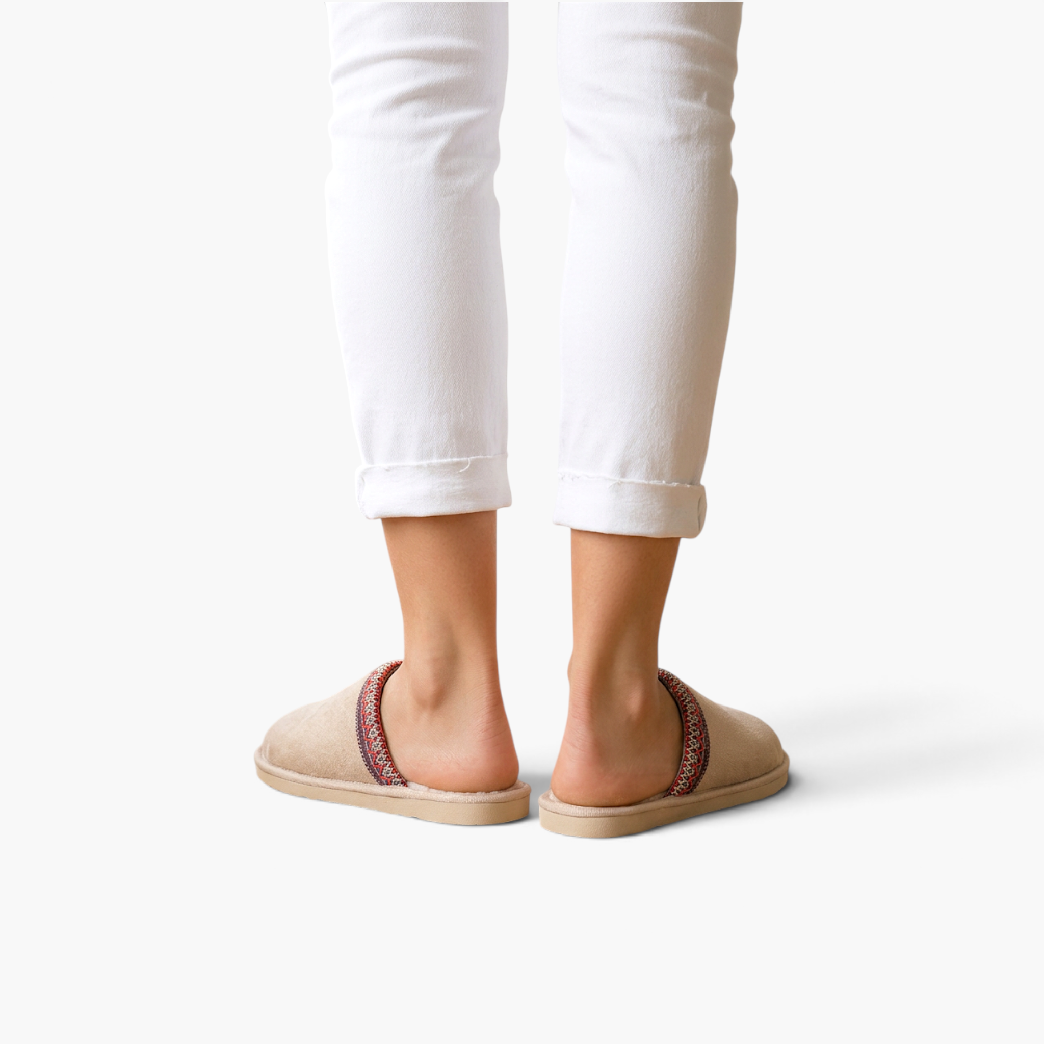 Beach Rose Co. Melanie winter slippers in beige suede with patterned trim worn with white trousers