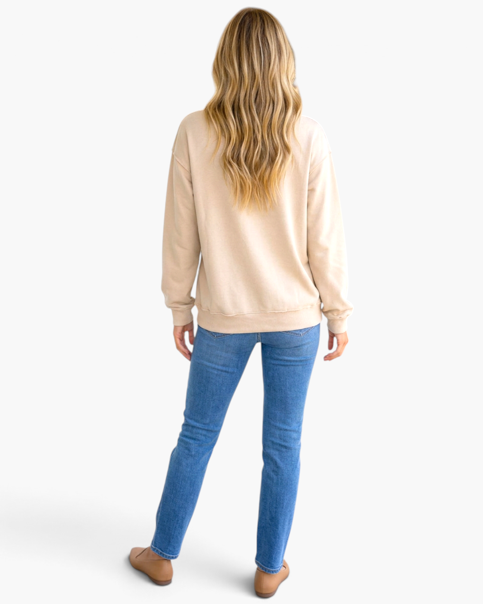 Beach Rose Co. beige relaxed fit sweatshirt worn with blue jeans, back view showing ribbed hem and long sleeves