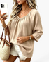 Beach Rose Co. beige textured V-neck blouse with loose three-quarter sleeves and a relaxed fit.