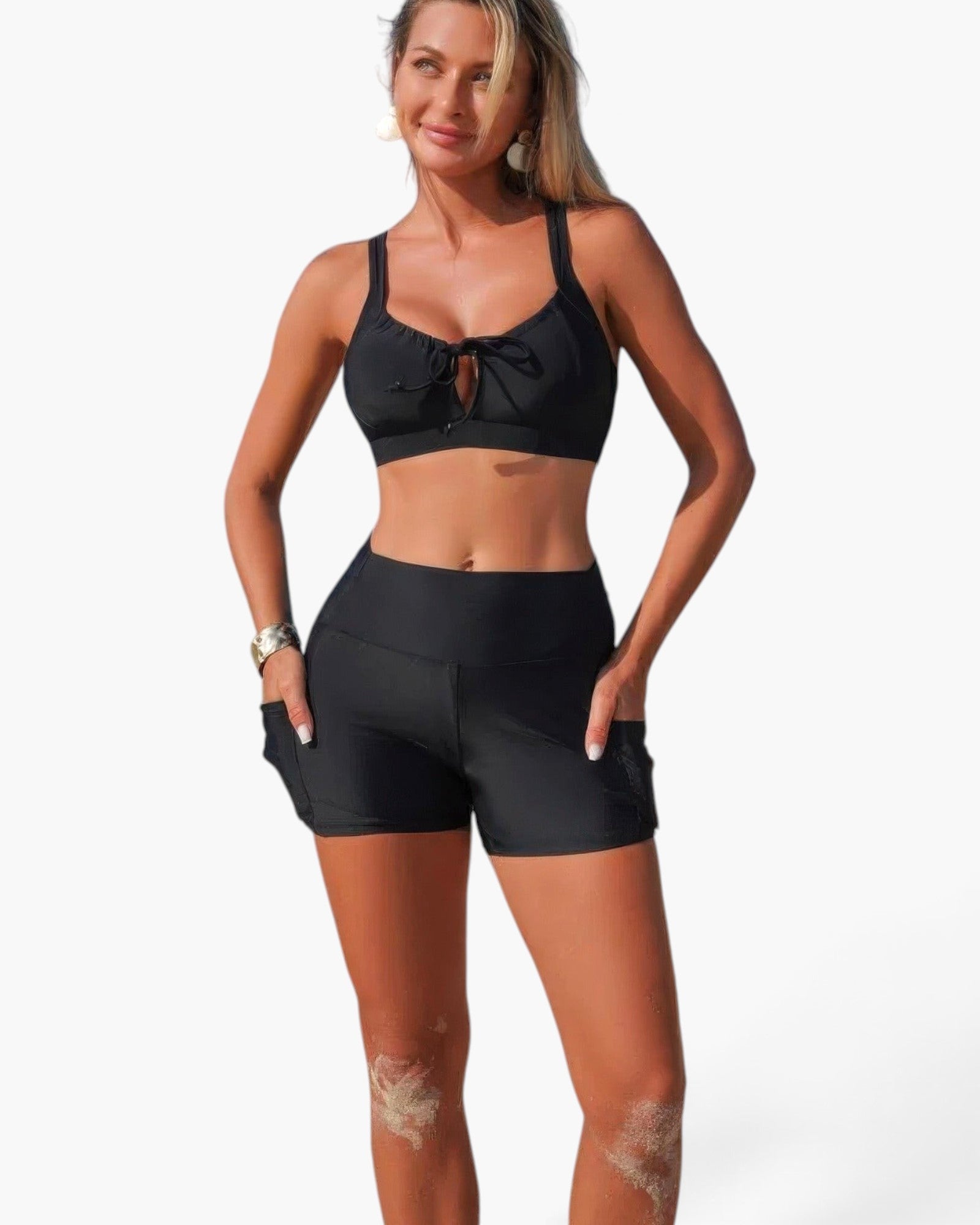 Beach Rose Co. black two-piece bikini with crisscross top and tummy control shorts on a model.