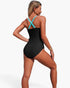 Beach Rose Co. one-piece swimsuit with black body and bright blue crisscross straps, viewed from the back.