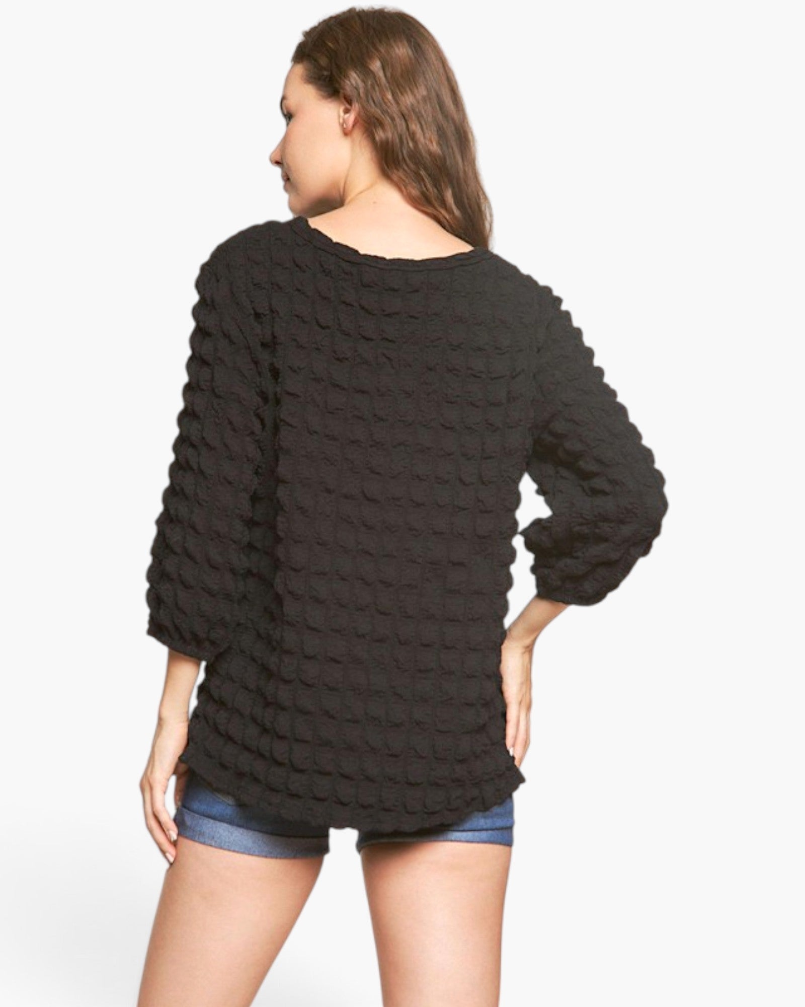 Beach Rose Co. black long sleeve top with bubble knit texture, round neckline, and gathered sleeves, back view.