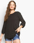 Beach Rose Co. black bubble knit long sleeve top with a round neckline and relaxed fit worn by a model.