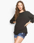 Beach Rose Co. black bubble knit long sleeve top with a round neckline and relaxed fit worn by a model.