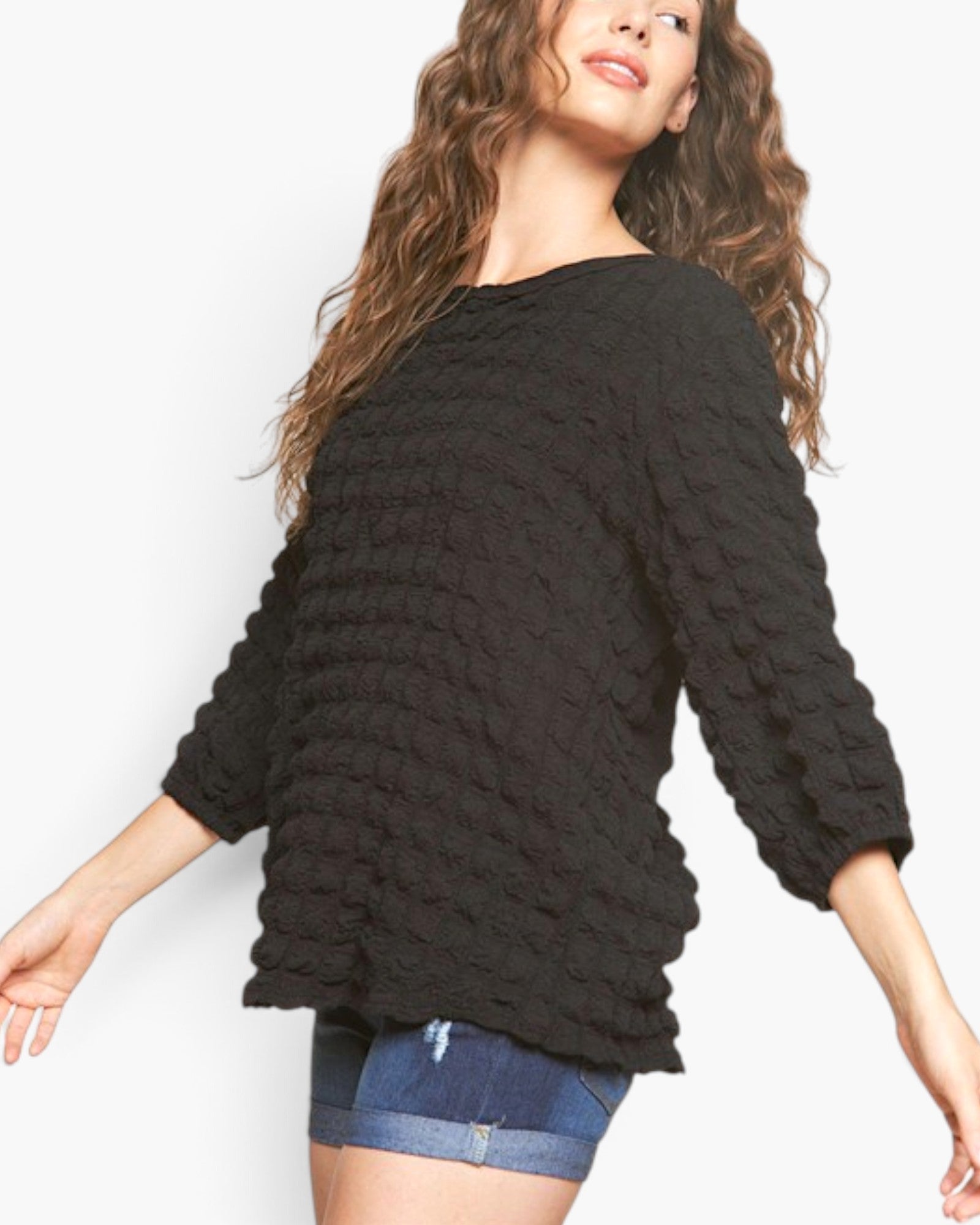 Beach Rose Co. black long sleeve top with bubble knit texture, round neckline, and relaxed fit worn by a model.