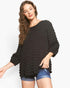 Beach Rose Co. black bubble knit long sleeve top with a round neckline and relaxed fit worn by a model