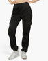 Beach Rose Co. black polyester sweatpants with side cargo pockets, drawstring waist, and relaxed fit on a model