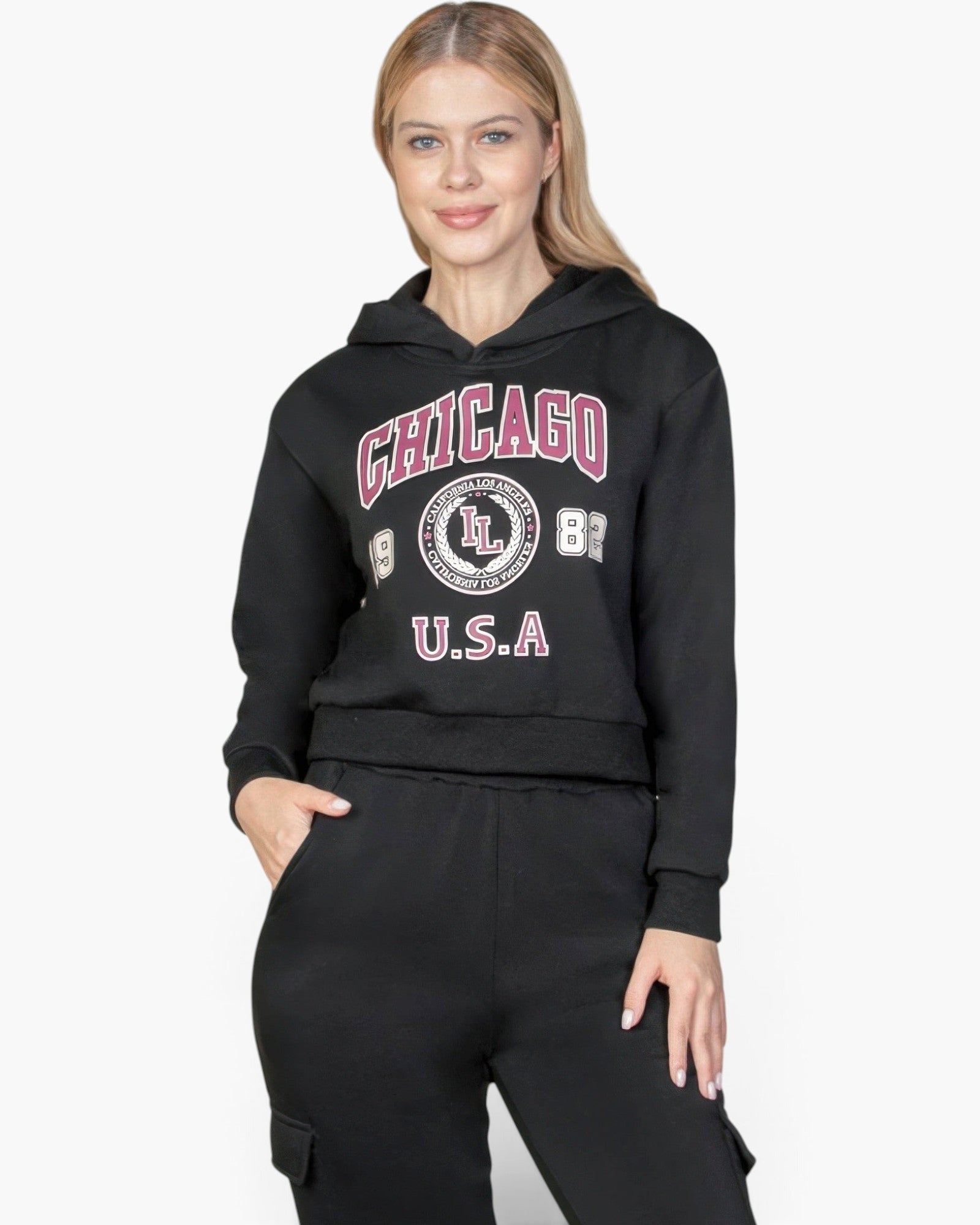 Beach Rose Co. black drop shoulder pullover hoodie with Chicago graphic print worn by a blonde model