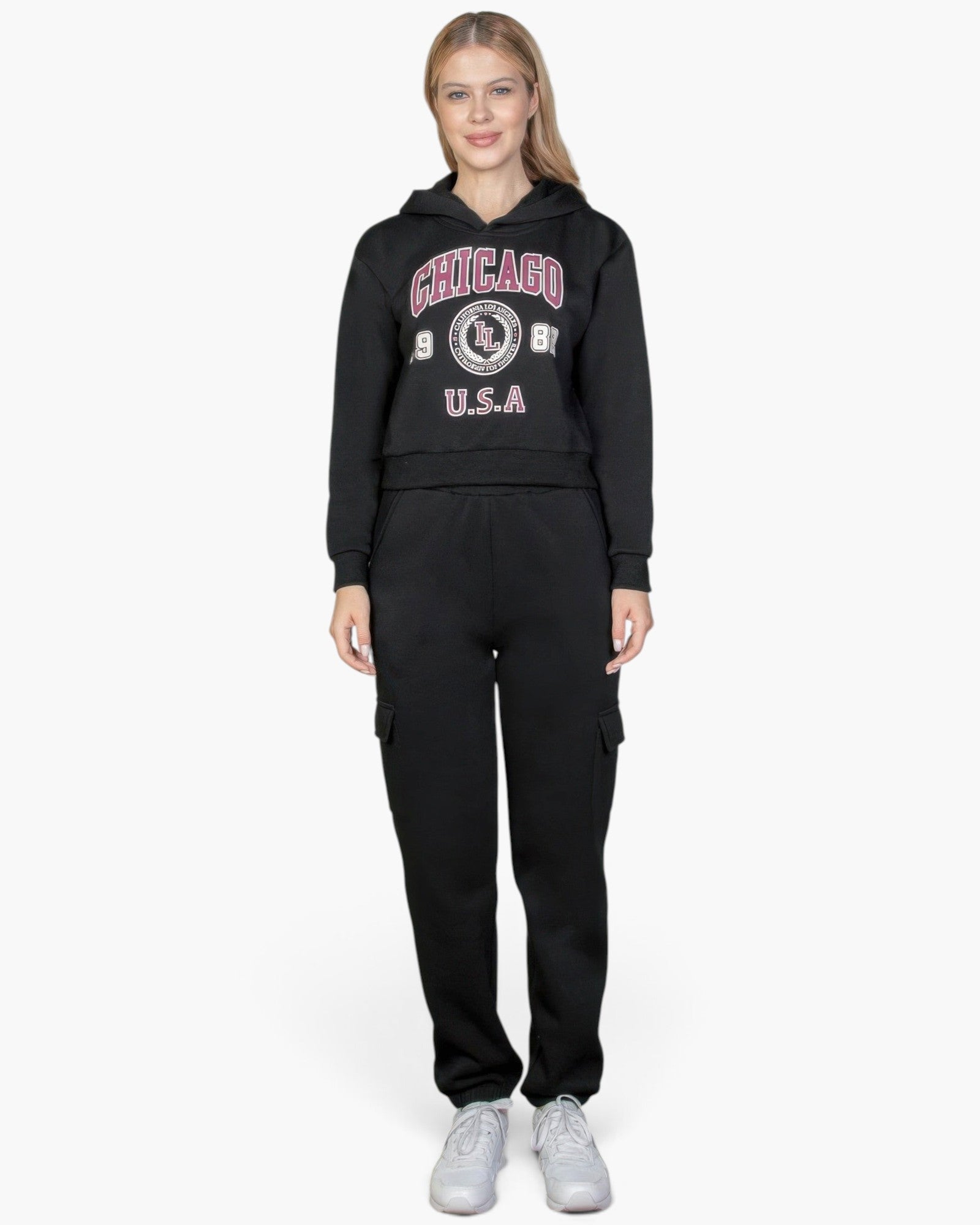 Beach Rose Co. black drop shoulder pullover hoodie with Chicago graphic, worn by a blonde model with black cargo pants.
