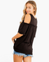 Beach Rose Co. black cold-shoulder top with ruffled sleeves and gathered detailing worn by a blonde model
