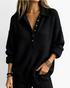Beach Rose Co. black relaxed knit sweater with a collared button placket, dropped shoulders, and ribbed trim.