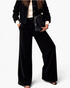 Beach Rose Co. black corduroy two-piece set featuring a button-front jacket and wide-leg pants on a model