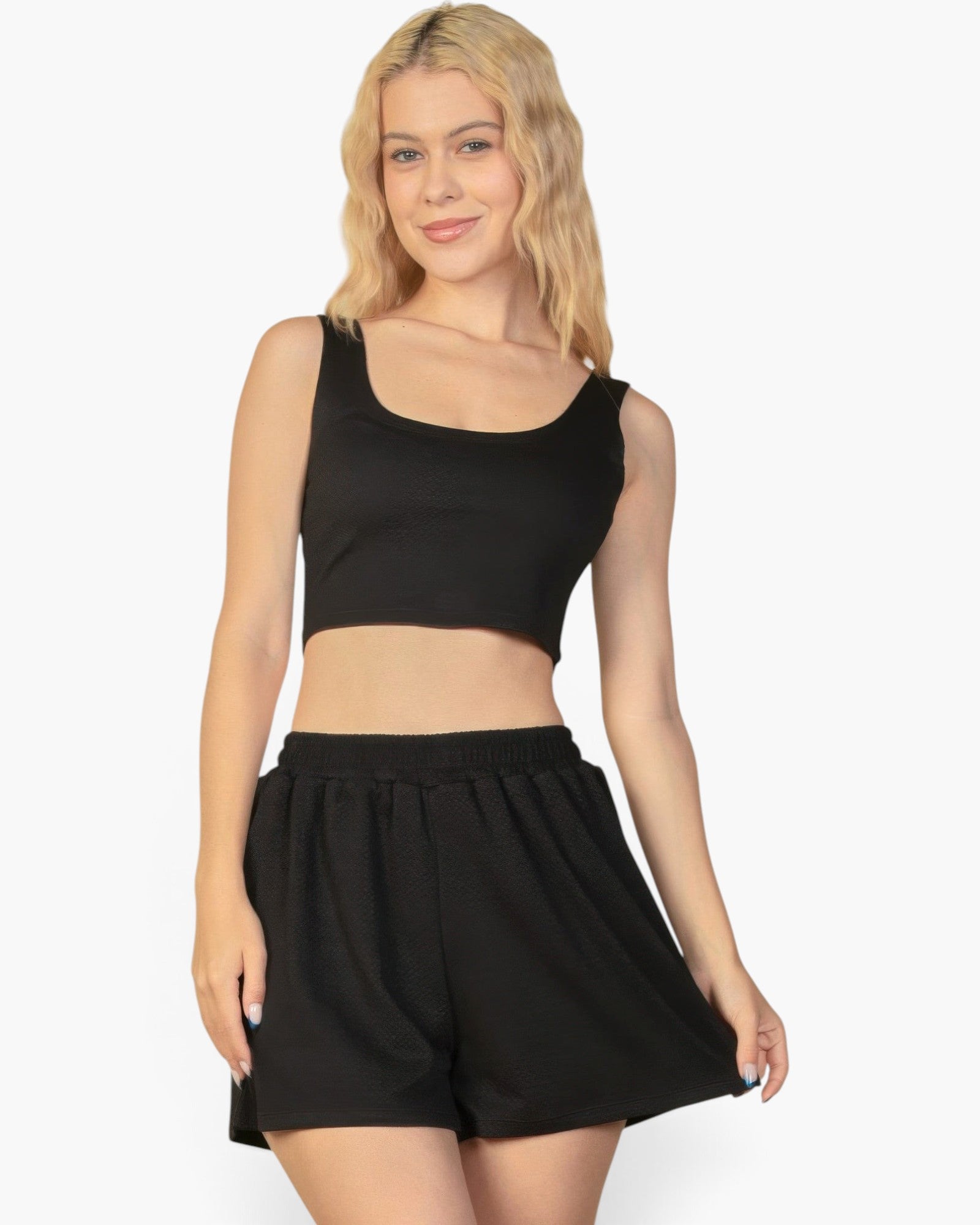 Beach Rose Co. black crop tank top and elastic waist shorts set in textured 4-way stretch fabric on a blonde model