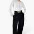 Beach Rose Co. black elastic waist belt featuring a gold geometric double diamond alloy buckle worn over trousers.