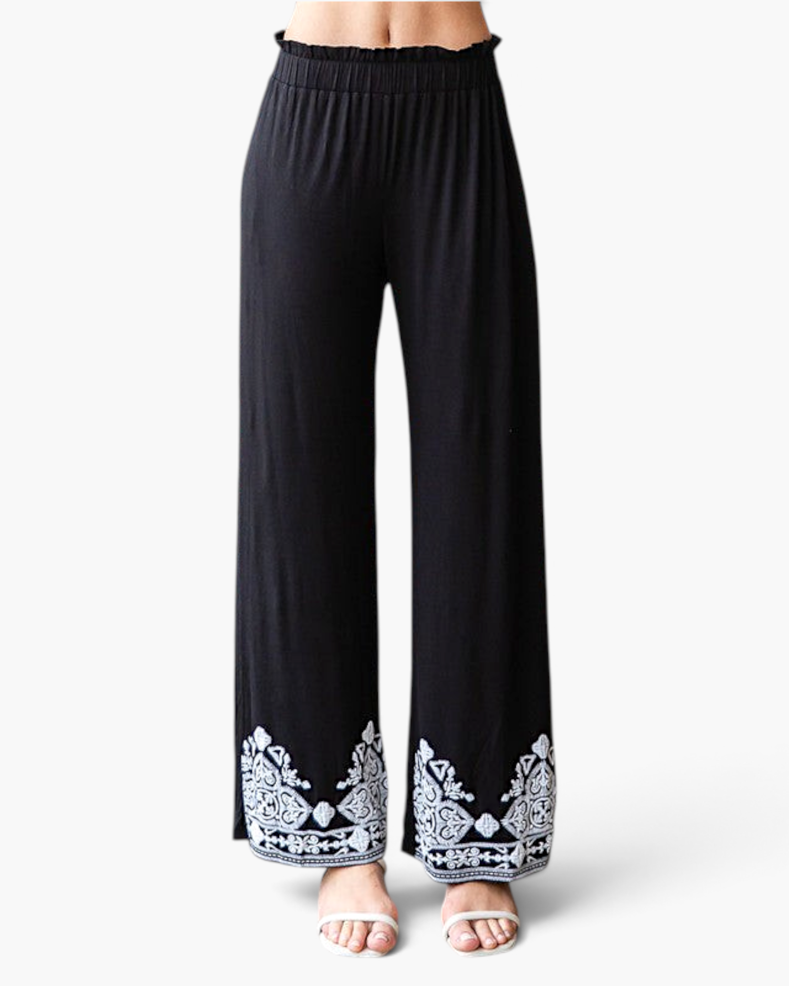 Beach Rose Co. black wide-leg pants with white embroidered hems, elastic waistband, and soft stretch rayon fabric.
