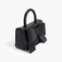 Beach Rose Co. black faux leather handbag featuring a structured silhouette and a decorative ribbon bow top handle.