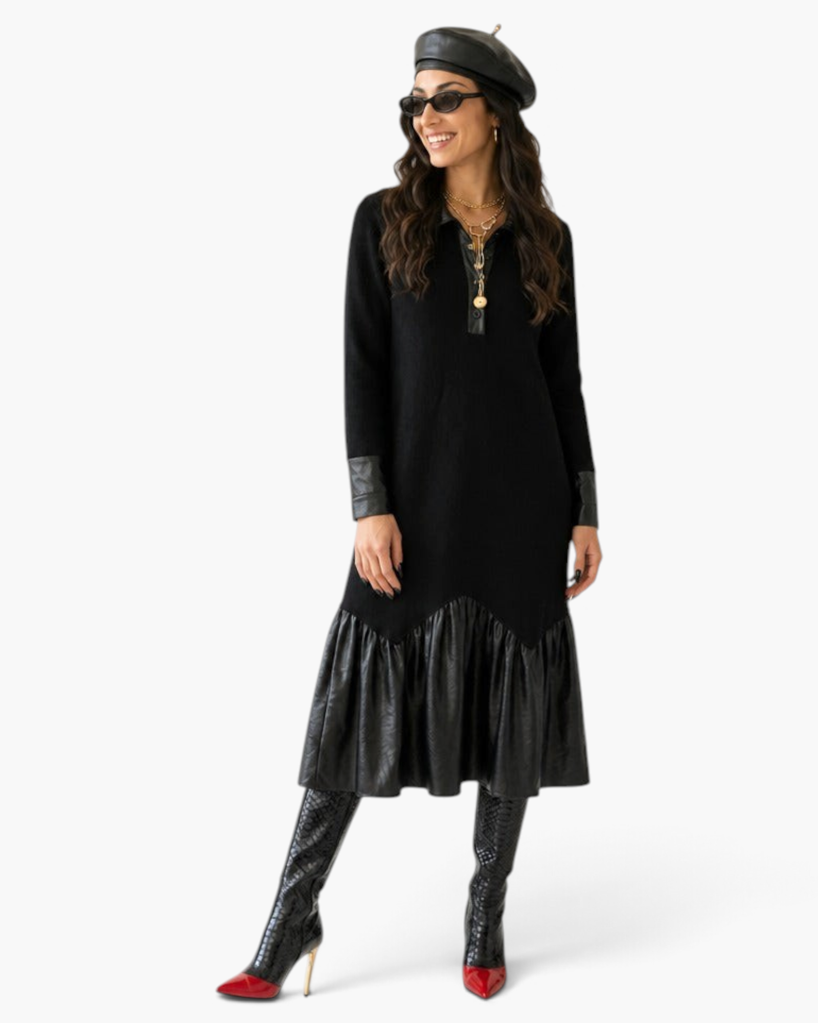 Model wearing a Beach Rose Co. black knit midi dress with faux leather trim, collar, cuffs, and a gathered hem.