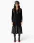 Beach Rose Co. black midi dress featuring a knit body, faux leather collar, cuffs, and a gathered faux leather hem.