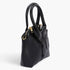 Beach Rose Co. black faux leather handbag with a unique shirt-style design, top handle, and gold zipper hardware.