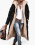 Beach Rose Co. black longline quilted coat with plush beige fleece lining, hood, and front zip, worn over jeans.