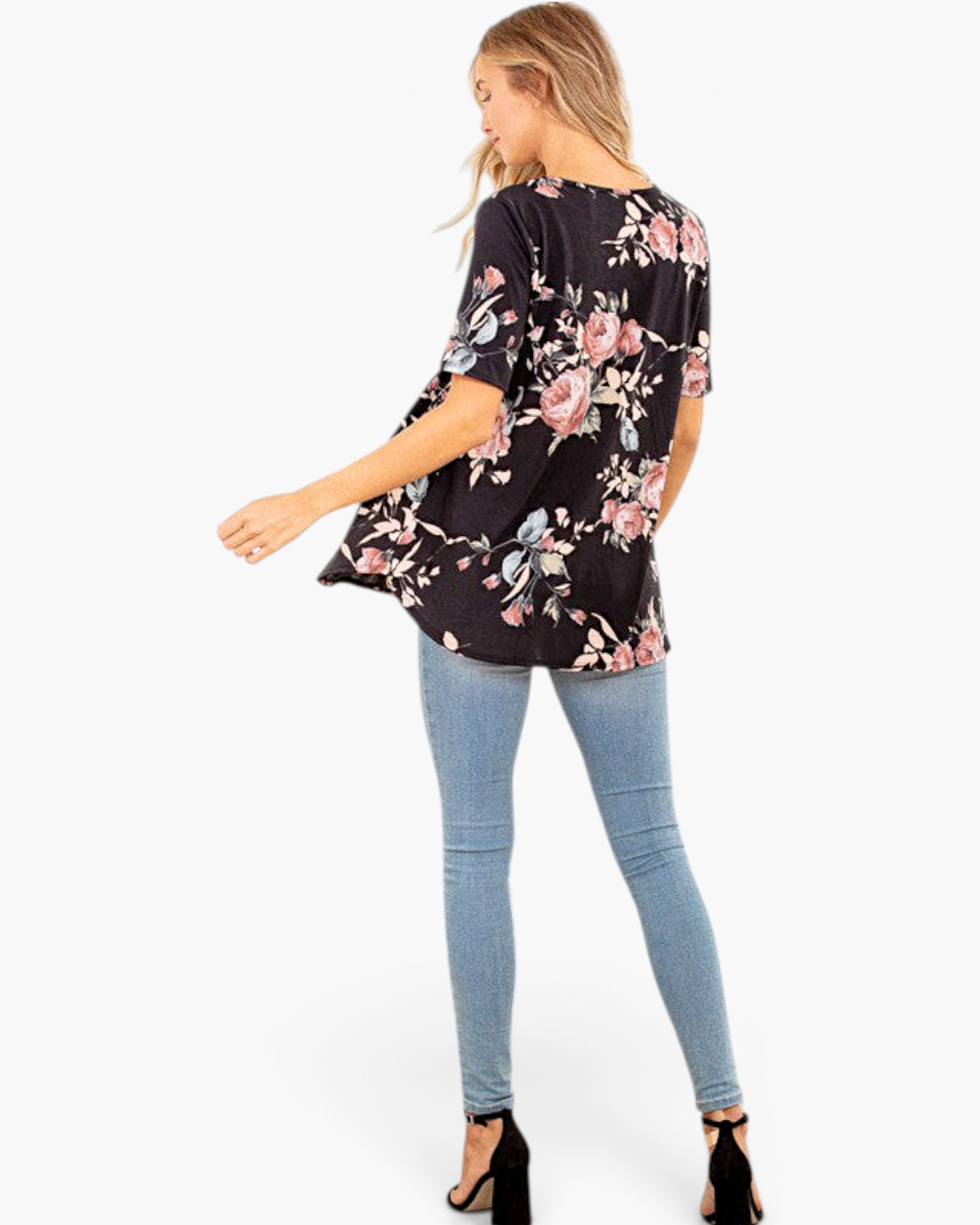 Beach Rose Co. black floral babydoll top with short sleeves and curved hem worn with skinny jeans and black heels
