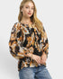 Beach Rose Co. black floral print blouse with gathered neckline, billowy sleeves, and elastic cuffs. Rayon/nylon blend.