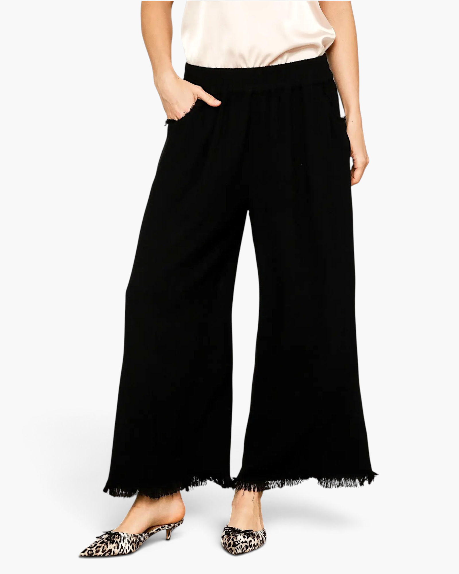Beach Rose Co. black wide-leg pants in a linen-cotton blend with an elastic waist, side pockets, and frayed raw hems.