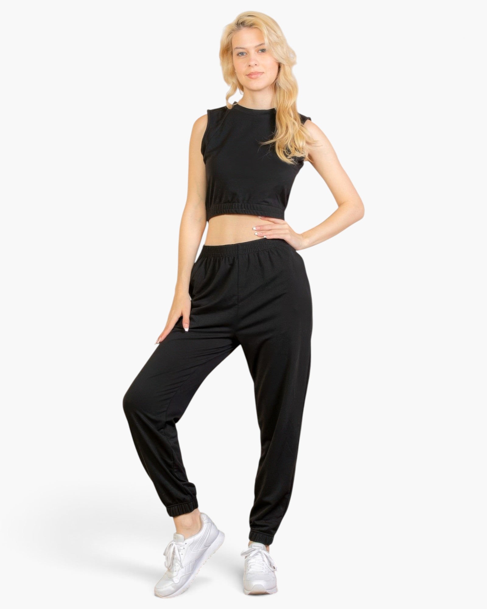 Beach Rose Co. black French Terry tank top and joggers set worn by a blonde model with white sneakers