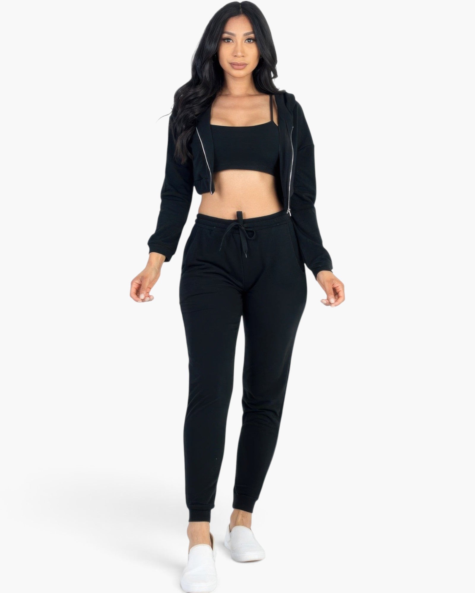 Beach Rose Co. black French terry three-piece set with cropped cami, zip-up jacket, and joggers on a model.