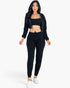 Beach Rose Co. black French terry three-piece set with cropped cami, zip-up jacket, and joggers on a model.