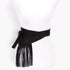 Beach Rose Co. black faux suede wrap belt featuring long fringe detailing on a white mannequin torso.