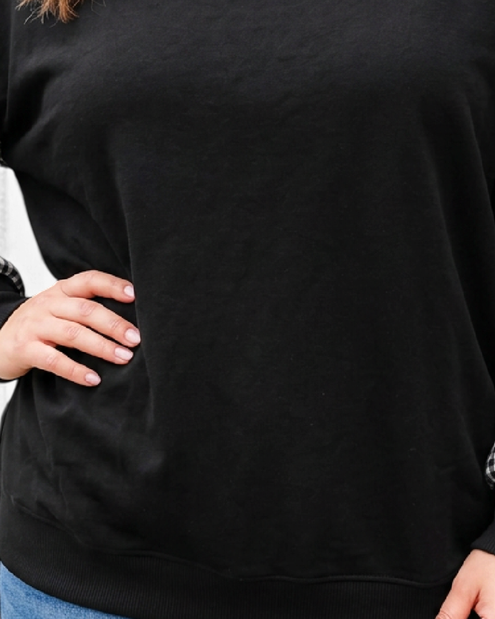 Beach Rose Co. plus size black sweatshirt featuring contrasting gingham sleeves and a ribbed mock neckline.