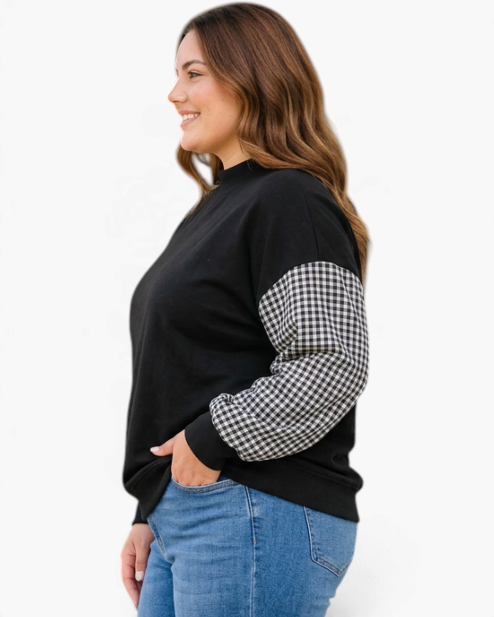 Beach Rose Co. plus size black sweatshirt with gingham sleeves and mock neck worn by a smiling woman in profile.
