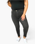 Beach Rose Co. high rise black skinny jeans with tummy control, worn by a model with a black top and white sneakers.