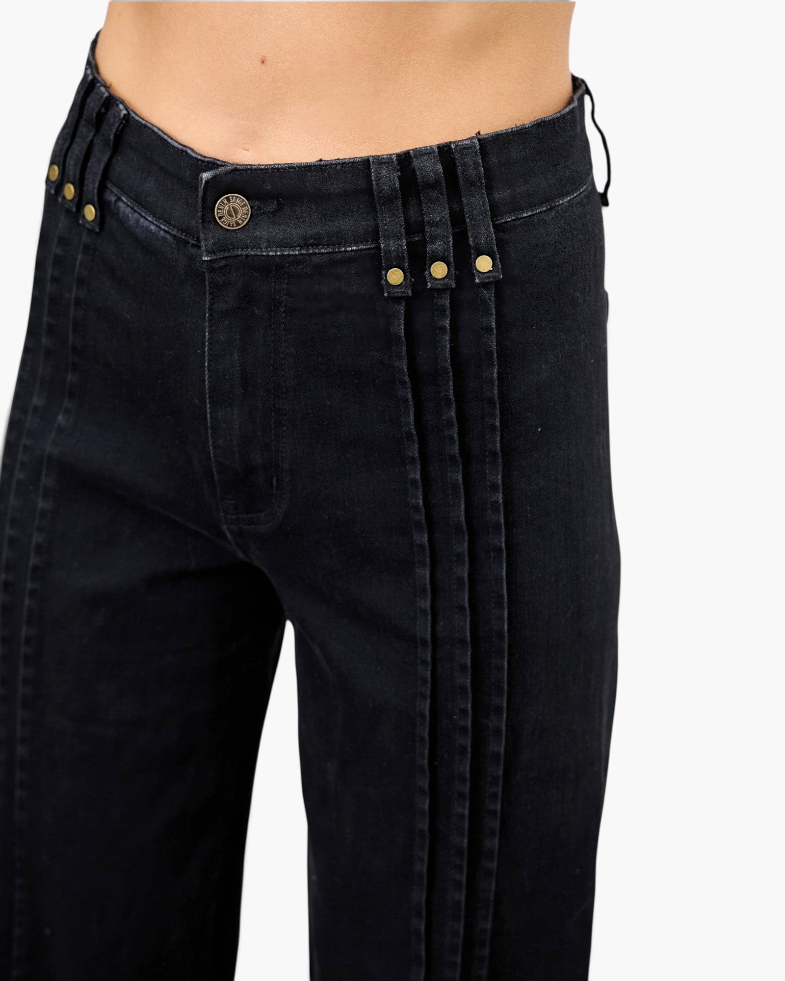 Beach Rose Co. black high-rise straight-leg jeans featuring structured front pleat lines and gold-tone hardware.