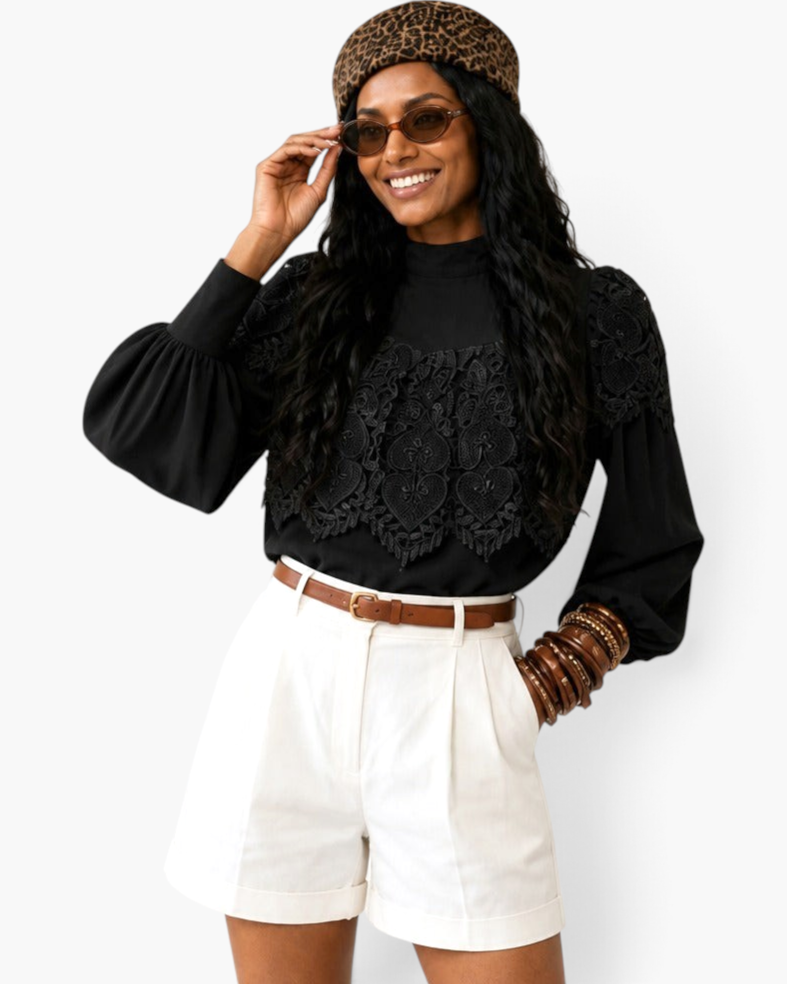 Beach Rose Co. black blouse with ornate lace overlay, high neckline, and balloon sleeves worn with white shorts