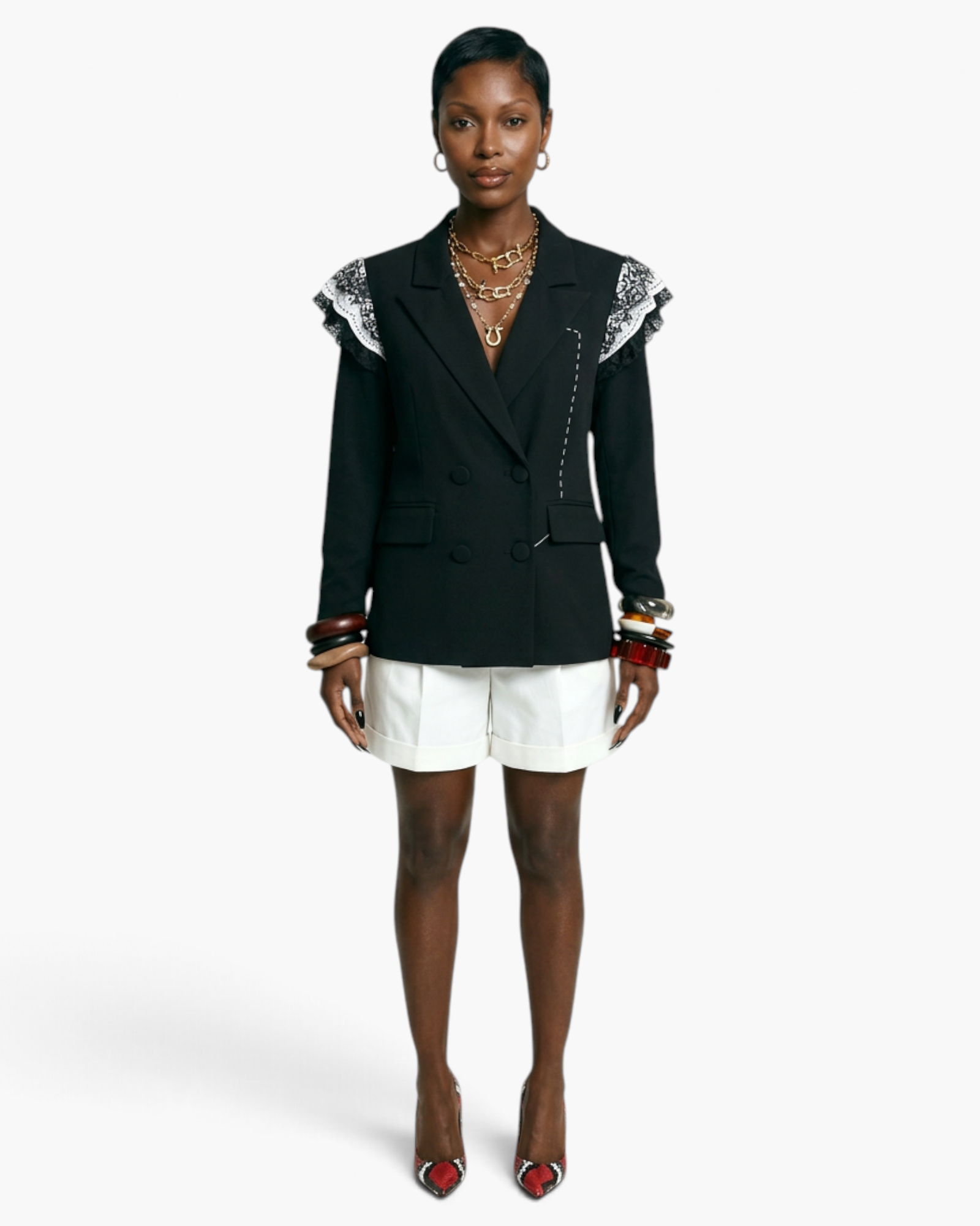 Model wearing a Beach Rose Co. black double-breasted blazer with lace-trimmed shoulders and white tailored shorts.