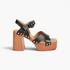 Beach Rose Co. black leather platform sandals with cross-strap design, silver stud accents, and block heel.