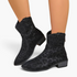 Beach Rose Co. black suede western ankle boots with a subtle leopard print, curved shaft, and low block heel.