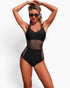 Beach Rose Co. black one-piece swimsuit featuring sheer mesh waist panels, ring-accented straps, and tummy control.