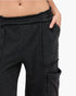 Beach Rose Co. black mineral wash cotton cargo pants with a high-rise elastic waistband and raw edge patch pockets.