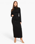 Beach Rose Co. black mock neck crop top with bell sleeves and matching maxi skirt with drawstring waist on a model